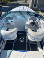 Speedboat on a body of water with a cloudy sky