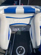 Speedboat on a body of water with a cloudy sky