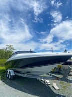 Speedboat on a body of water with a cloudy sky