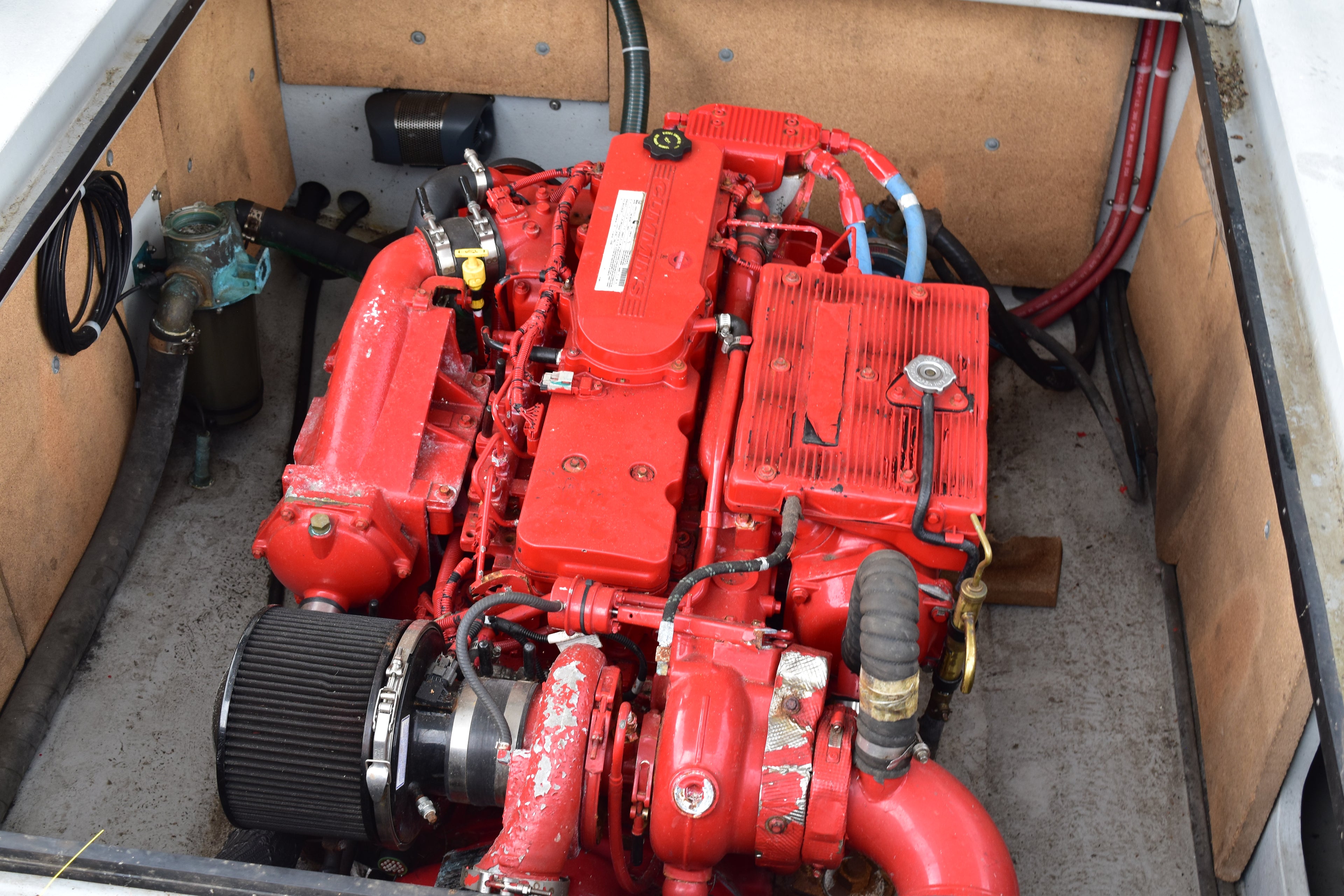 Red engine inside a vehicle or machinery compartment