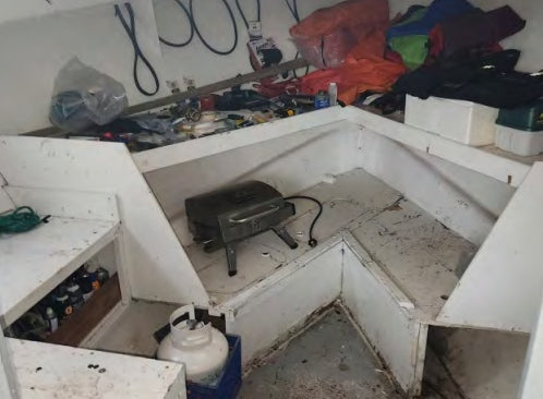 Messy workshop with tools and equipment on a workbench