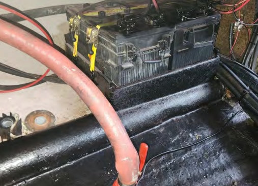 Car battery with cables connected in a mechanical setting
