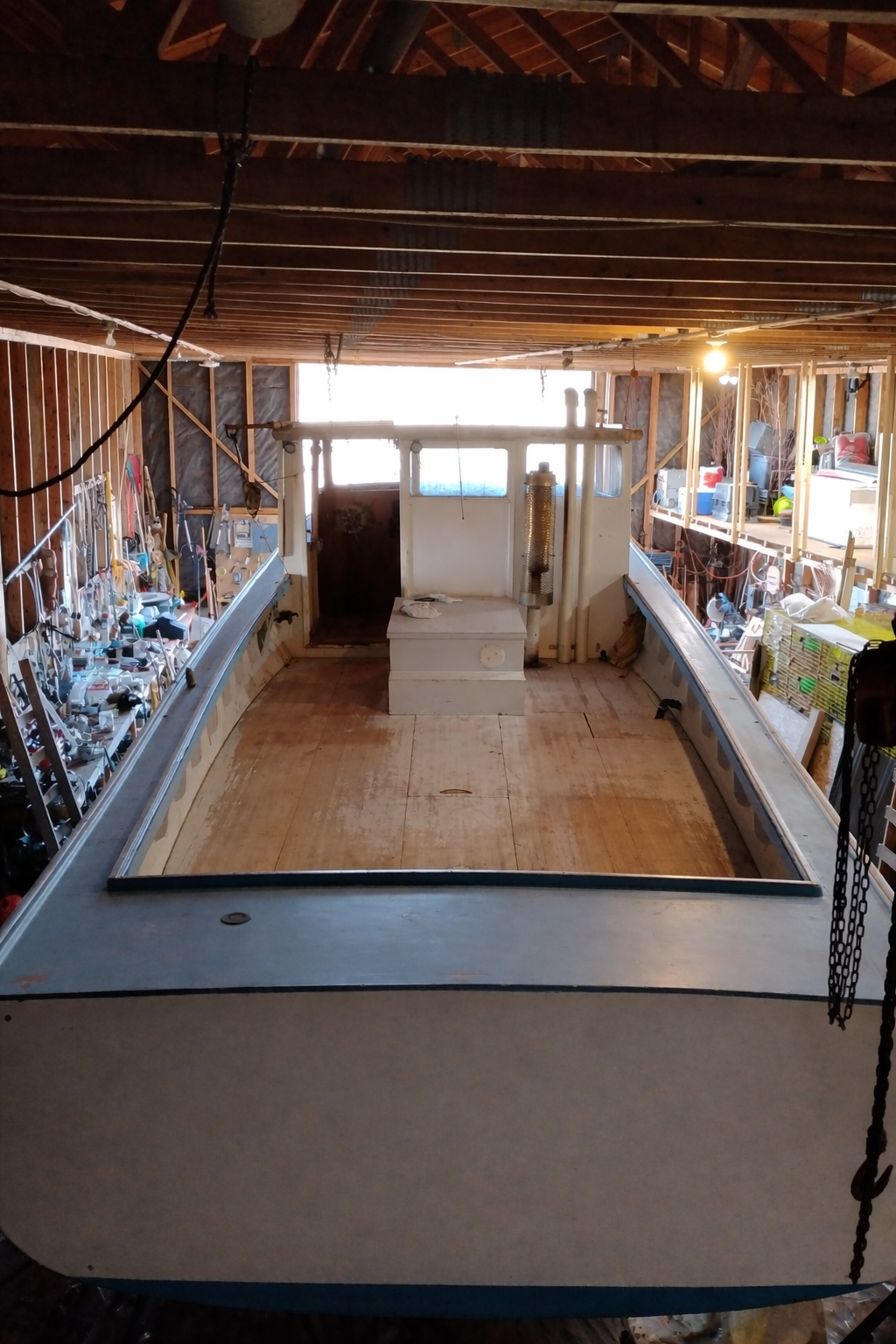 Basement with unfinished walls and floor, showing construction or renovation work.
